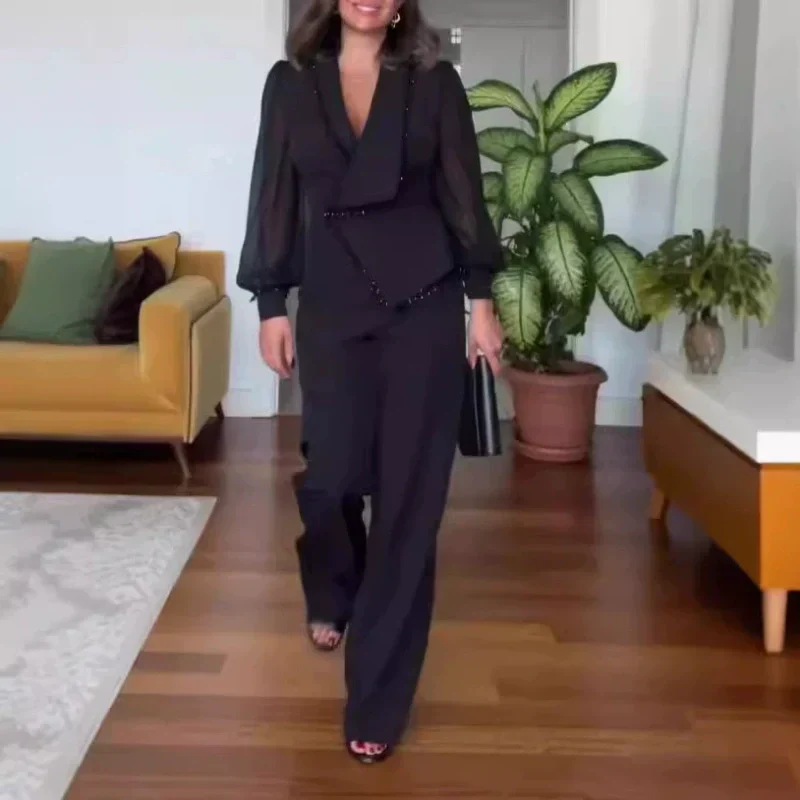 LINA - Jumpsuit noire élégante avec jambes larges et perles