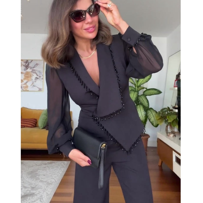 LINA - Jumpsuit noire élégante avec jambes larges et perles