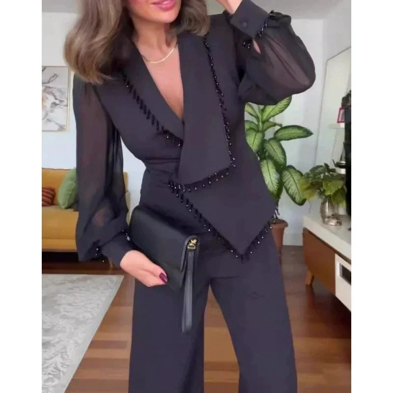 LINA - Jumpsuit noire élégante avec jambes larges et perles