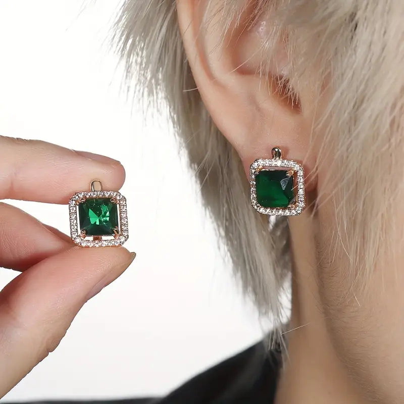 Boucles d'oreilles avec zircons carrés vert doré | Or